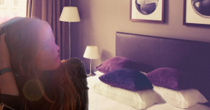 Woman looking at three pillows on the bed